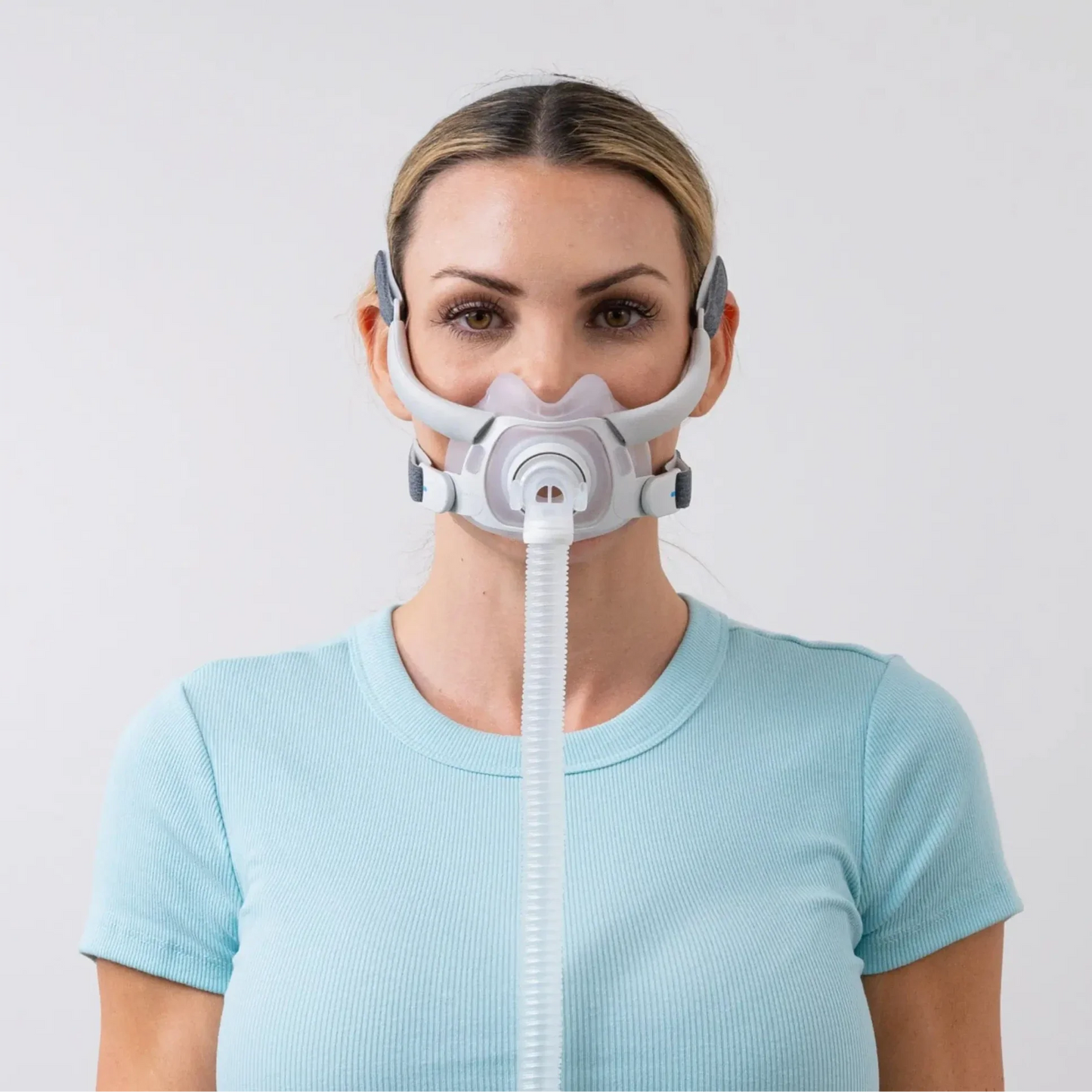 https://cdn.shopify.com/s/files/1/0318/9771/4819/files/woman-using-the-resmed-airfit-f40-full-face-cpap-mask-front-view.webp?v=1745254668