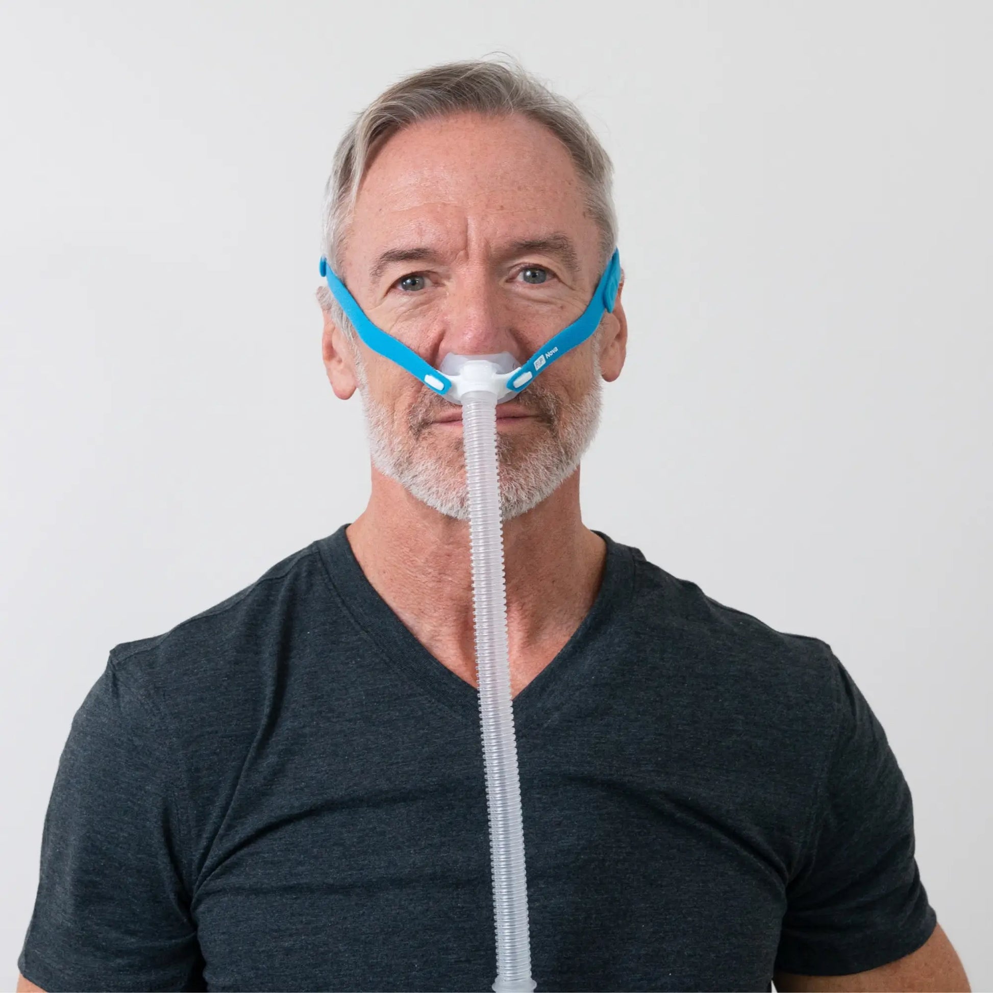 https://cdn.shopify.com/s/files/1/0318/9771/4819/files/man-using-the-fandp-nova-micro-nasal-pillows-cpap-mask-front-view-sleeplay-copyright.webp?v=1733934623