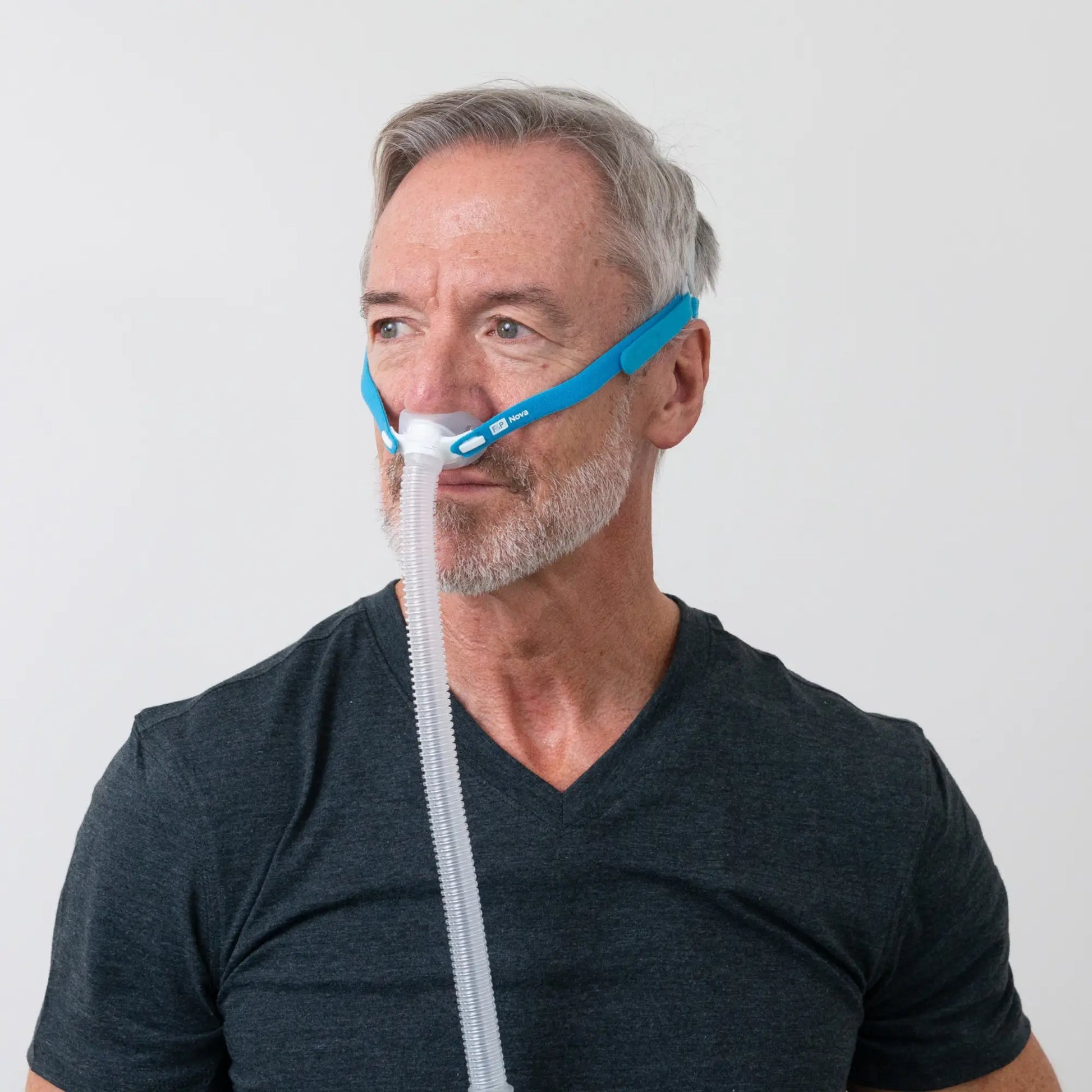 https://cdn.shopify.com/s/files/1/0318/9771/4819/files/man-using-the-fandp-nova-micro-nasal-pillows-cpap-mask-side-view.webp?v=1733934402