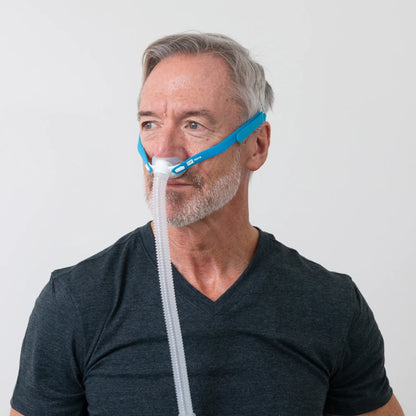 https://cdn.shopify.com/s/files/1/0318/9771/4819/files/man-using-the-fandp-nova-micro-nasal-pillows-cpap-mask-side-view.webp?v=1733934402