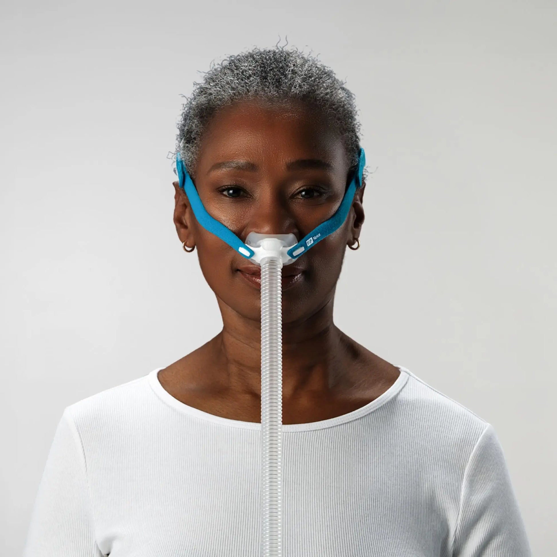 https://cdn.shopify.com/s/files/1/0318/9771/4819/files/woman-using-the-fandp-nova-micro-nasal-pillows-cpap-mask-front-view_d9ada896-b7c0-4248-a2ab-290d837cf366.webp?v=1733934561