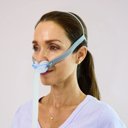 https://cdn.shopify.com/s/files/1/0318/9771/4819/files/woman-using-the-resmed-airfit-p10-nasal-cpap-mask-side-view.webp?v=1745354257